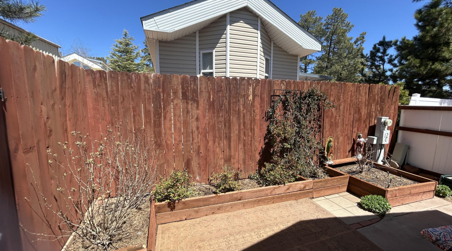 Backyard fenced with planters and drip s
