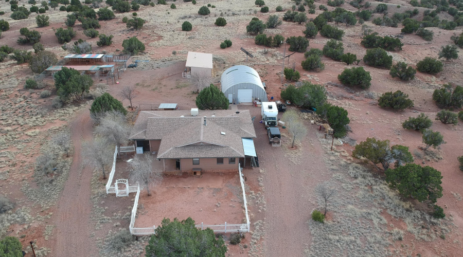 Aerial view of house & structures