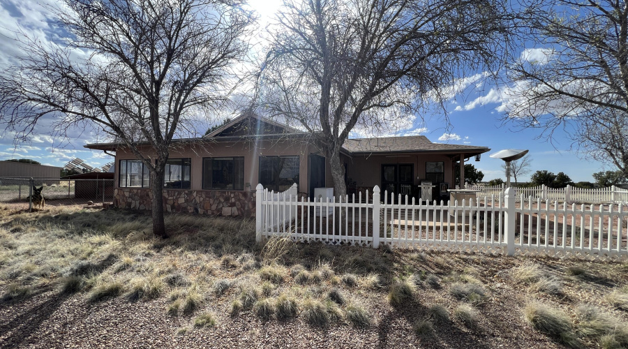 Separate fenced area in front of house.