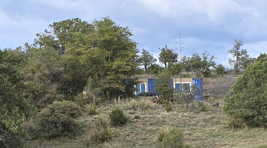 Container Home Hidden on a Knoll