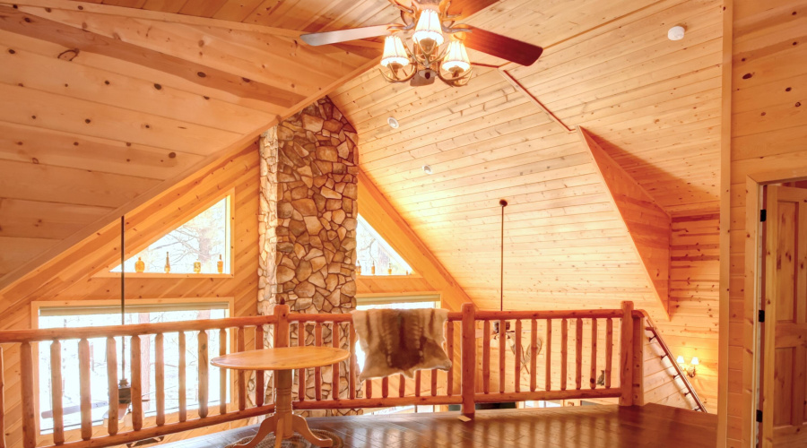 Loft with log railing