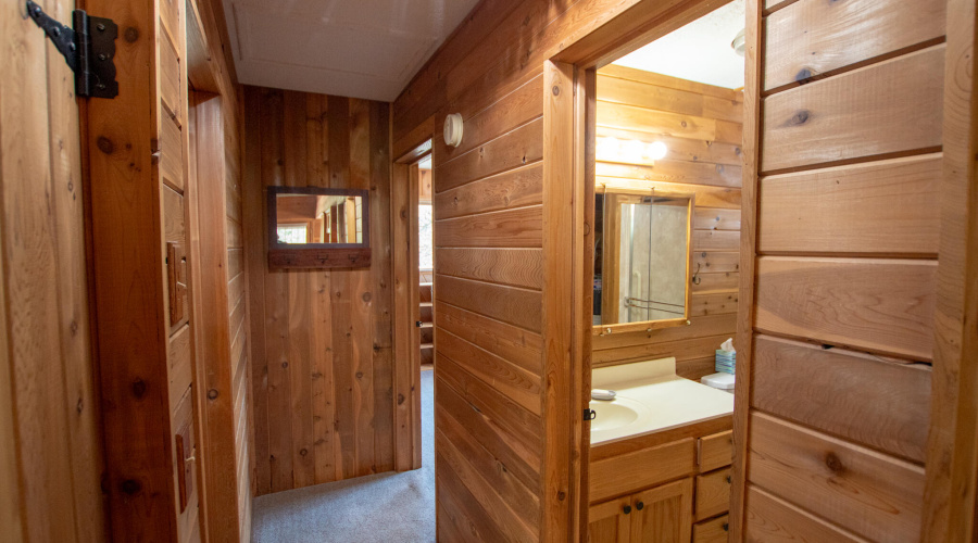 Hallway to first bath and bedrooms