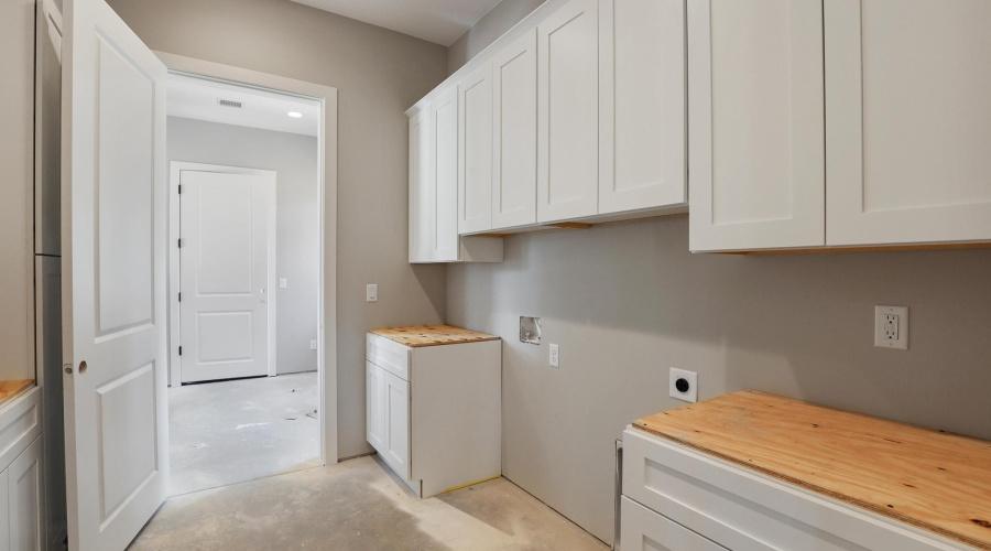 Laundry Area with Many Cabinets