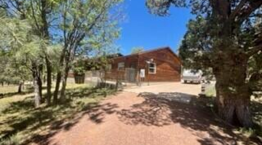 side of house with concrete slab drive