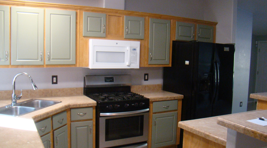 Kitchen stove, microwave and fridge