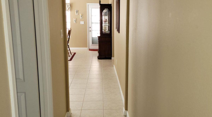 Entrance to laundry room on left