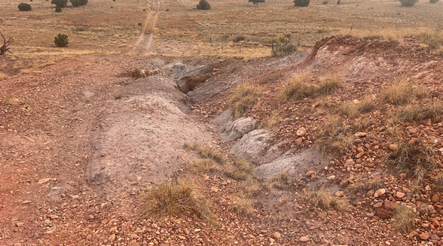 Rut in road at top of hill