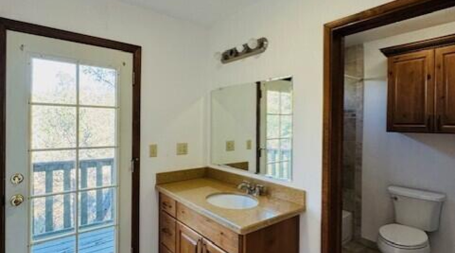 master bathroom with balcony exit