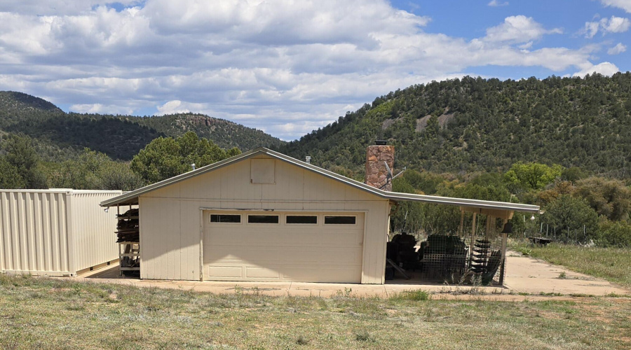 Garage attached to W side of Home