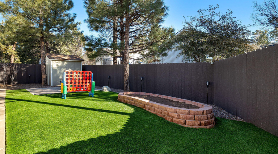 Shed, Raised Flower Bed & Grassy Area