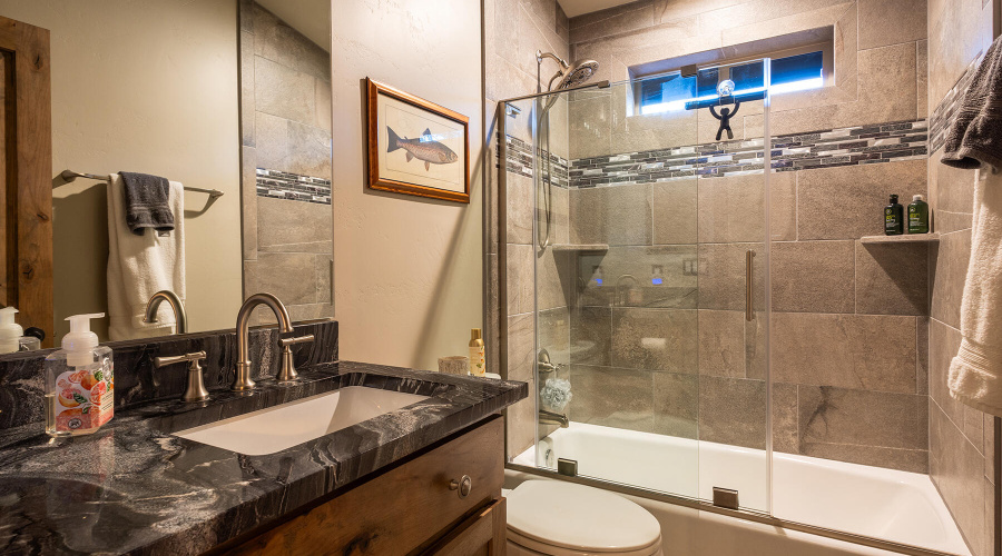 Guest bath with glass tub shower combo