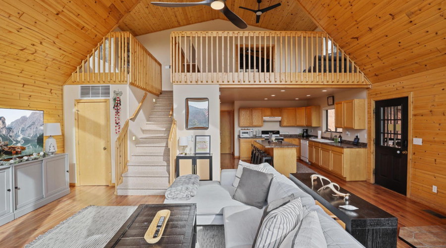 Living room with loft above