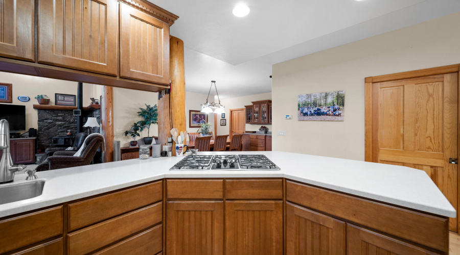 F view of gas stove top into dining room