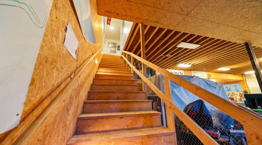 F stairs in work shop to up bunk room