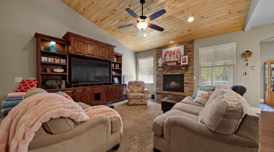 A living room fireplace and entertainmen