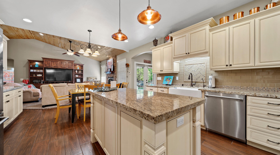 A kitchen view to dining area and living