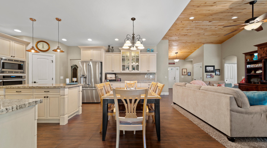 A dining area, living room and kitchen