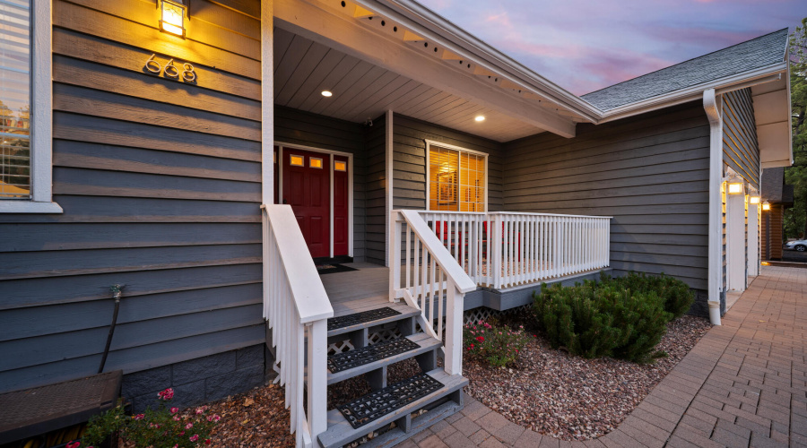 A twilight front porch & front door