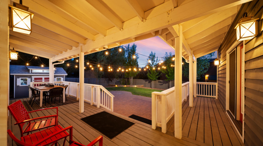 A twilight deck back yard view
