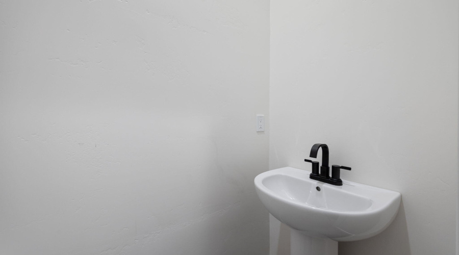 Half bath by garage and laundry room