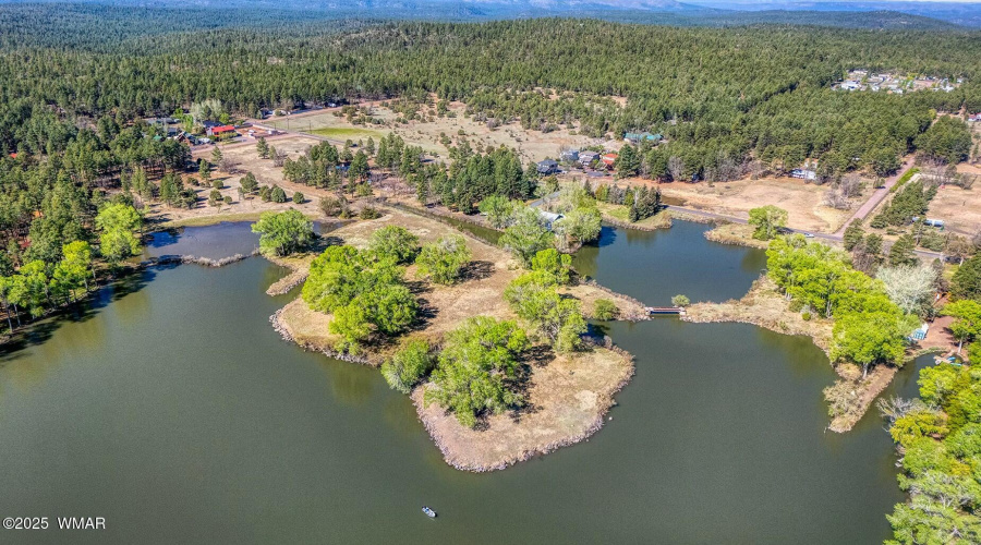 Aerial of spring-filled lake - Larson rd