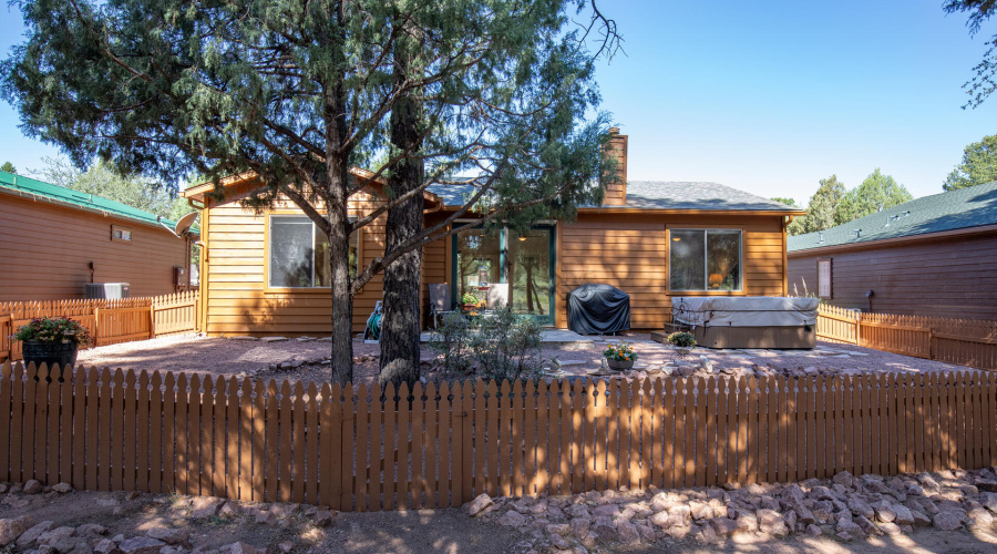 Backyard fenced w trees