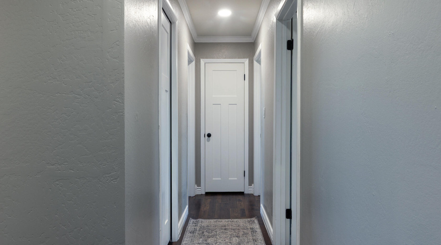Hallway to 3 bedrooms and 2 bathrooms