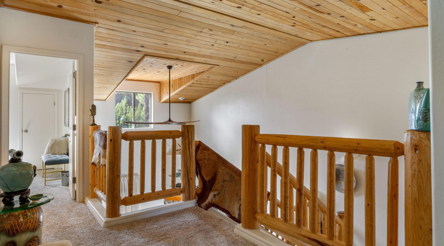 Upstairs landing with log accents