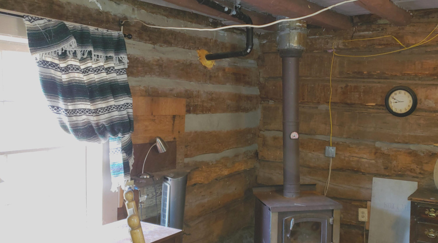 Log Hm Window N side & Wood Stove