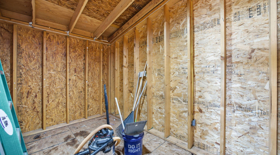Storage shed off carport