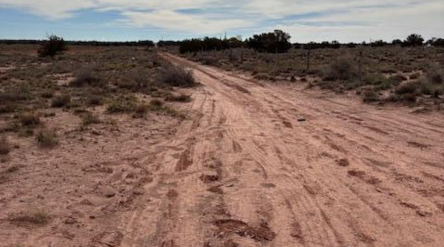 Pima road on the side of property