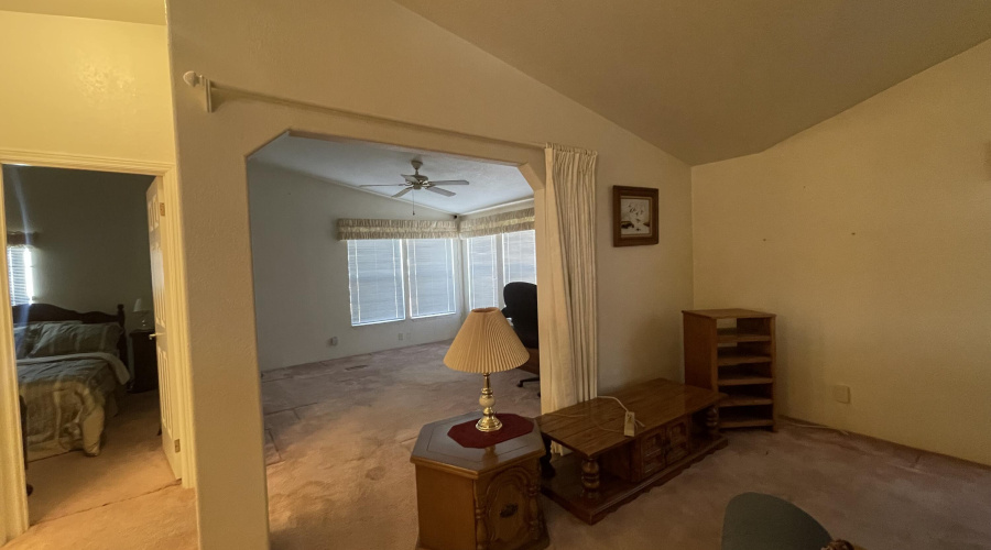 living room with adjoining den