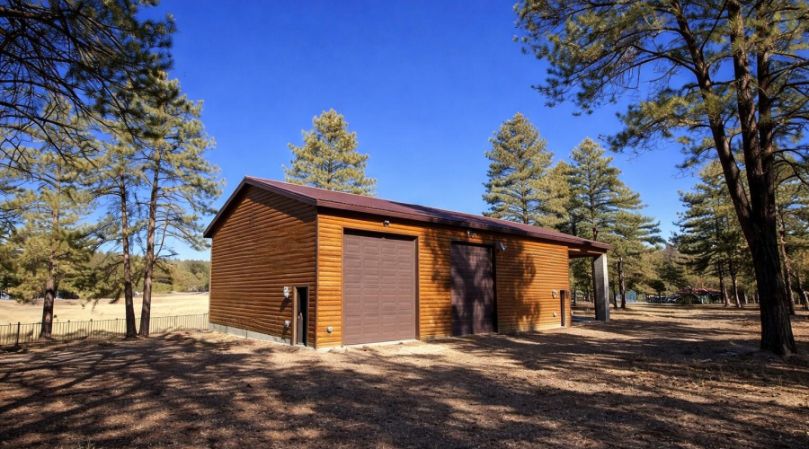 Wooden garage in forest setting