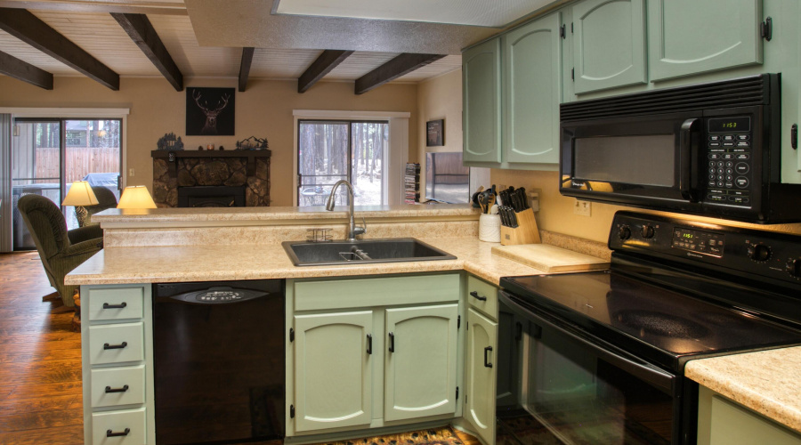 Kitchen w view into living area.