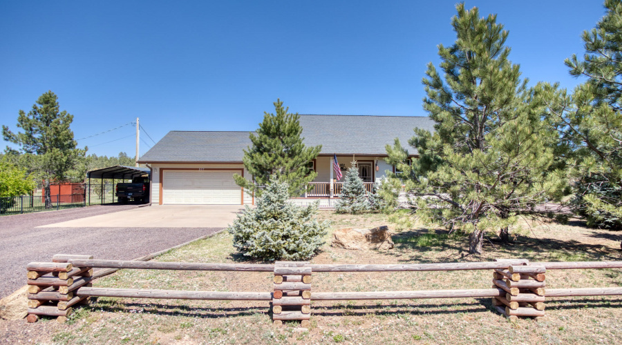Log railings around front of property