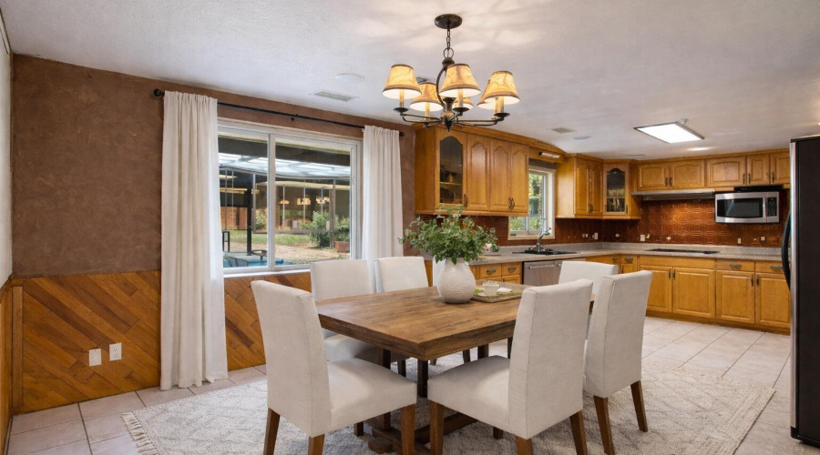 Modern farmhouse dining with kitchen vie