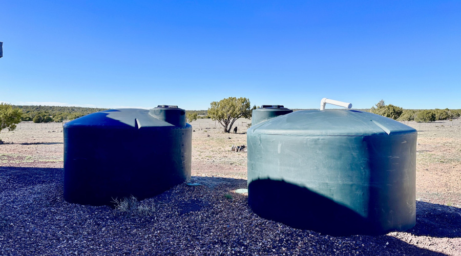 (2) 1550 gal water storage containers