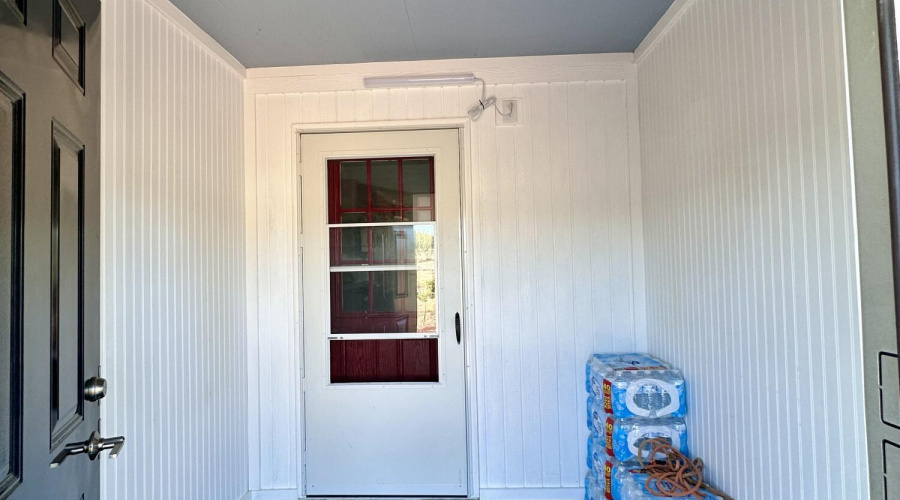 Storm door and mudroom