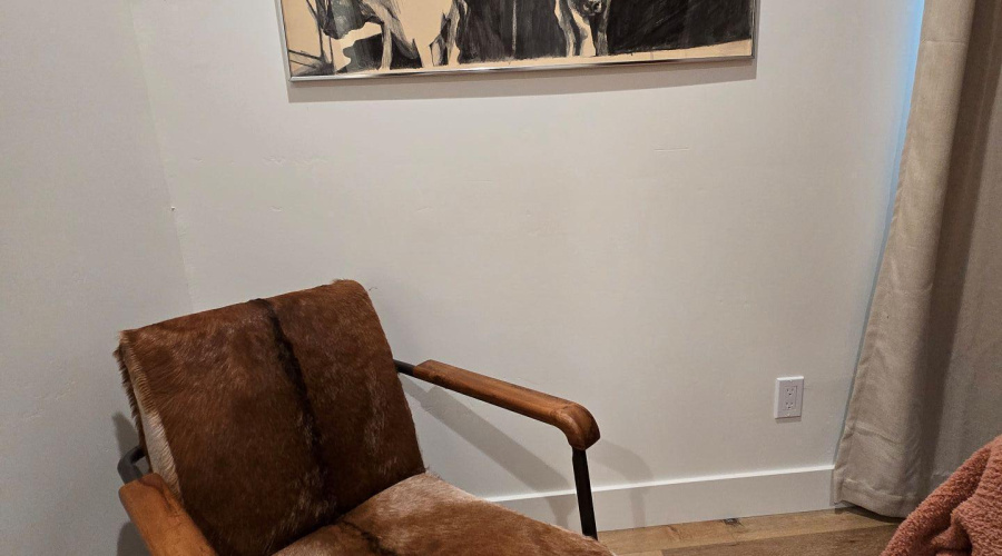Chair and painting in bedroom 2