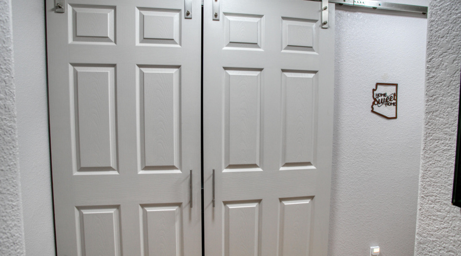 Laundry behind barn doors