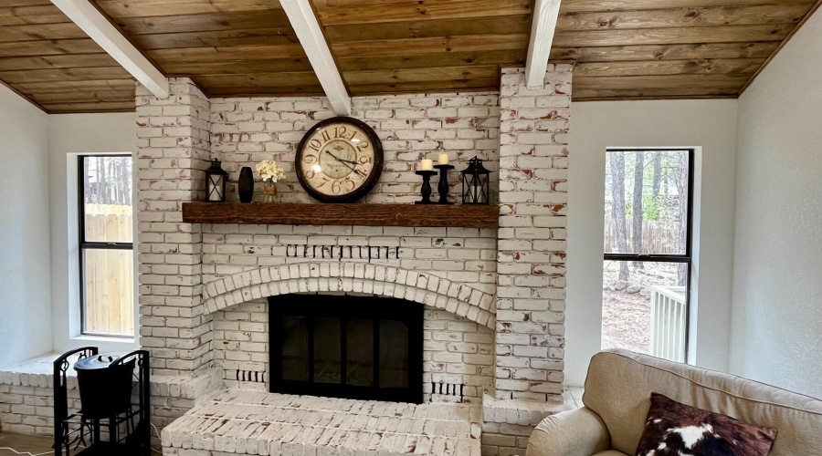 Gorgeous white washed brick fireplace