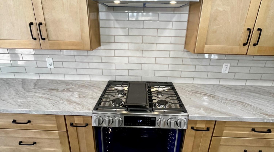 Gas range with stainless hood vent
