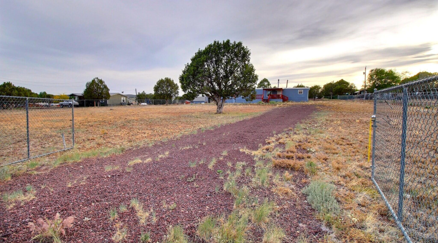 .98 acres, chain linked fenced