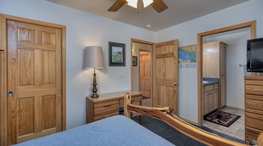 Primary bed view into bathroom